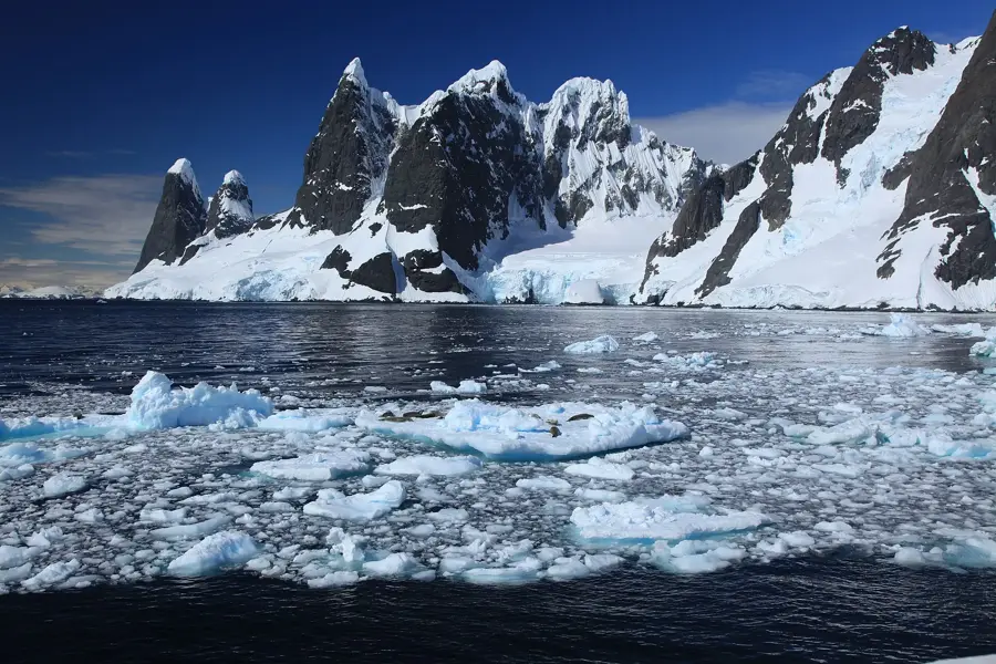 Zodiac against the ice shelf