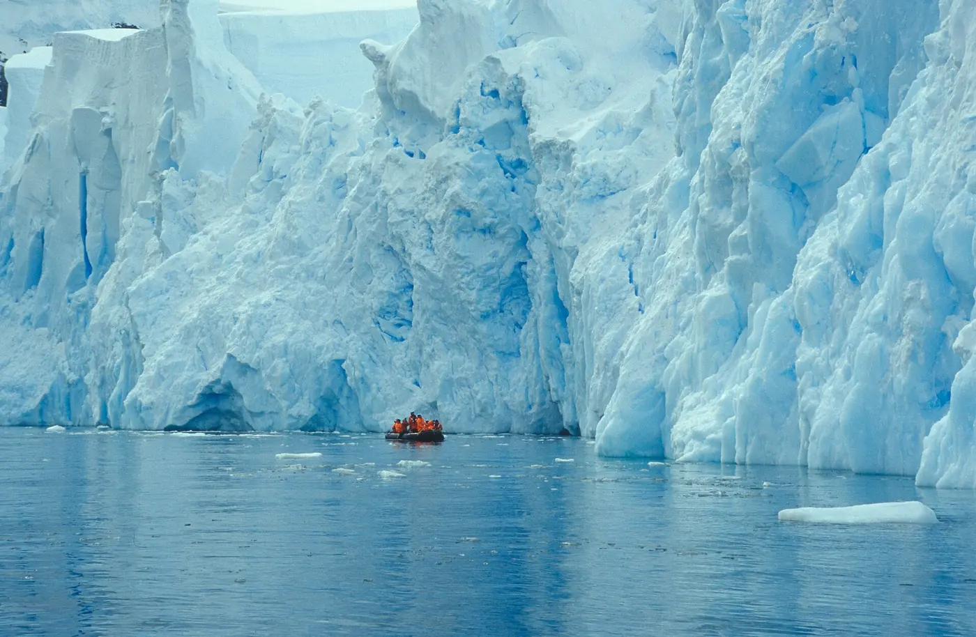 Photo: NOAA Photo Library (public domain) A Zodiac below a glacier face in the South Shetland Islands