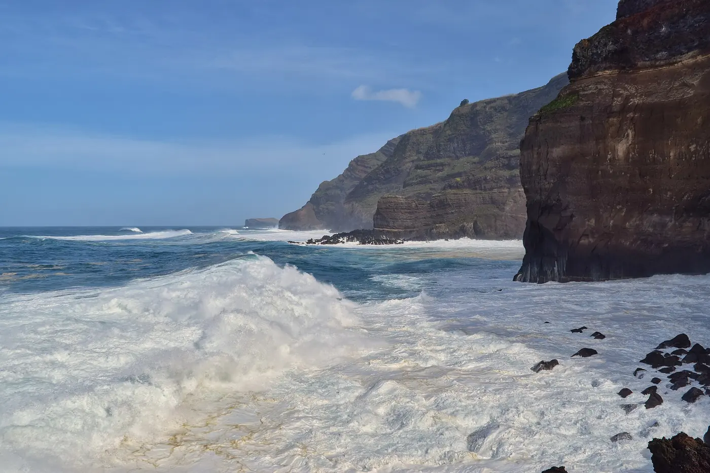 Surf breaking on the lava coast at Ponta da Ferraria