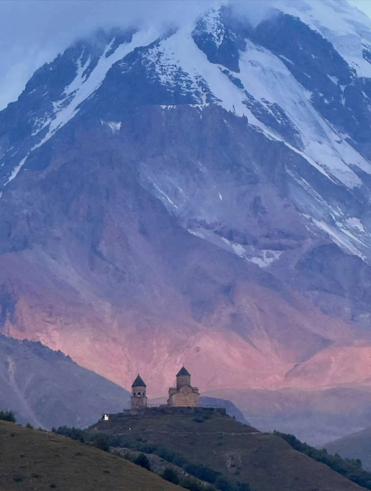 Gergeti Trinity Church under Kazbek at dusk