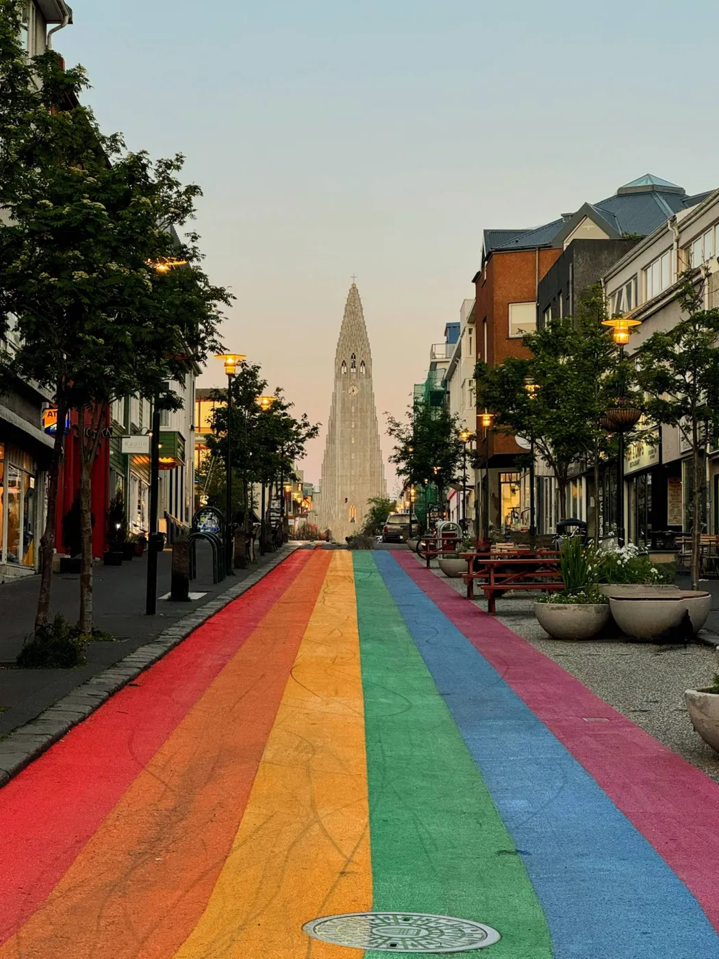 Rainbow street in Reykjavík leading to Hallgrímskirkja at dusk