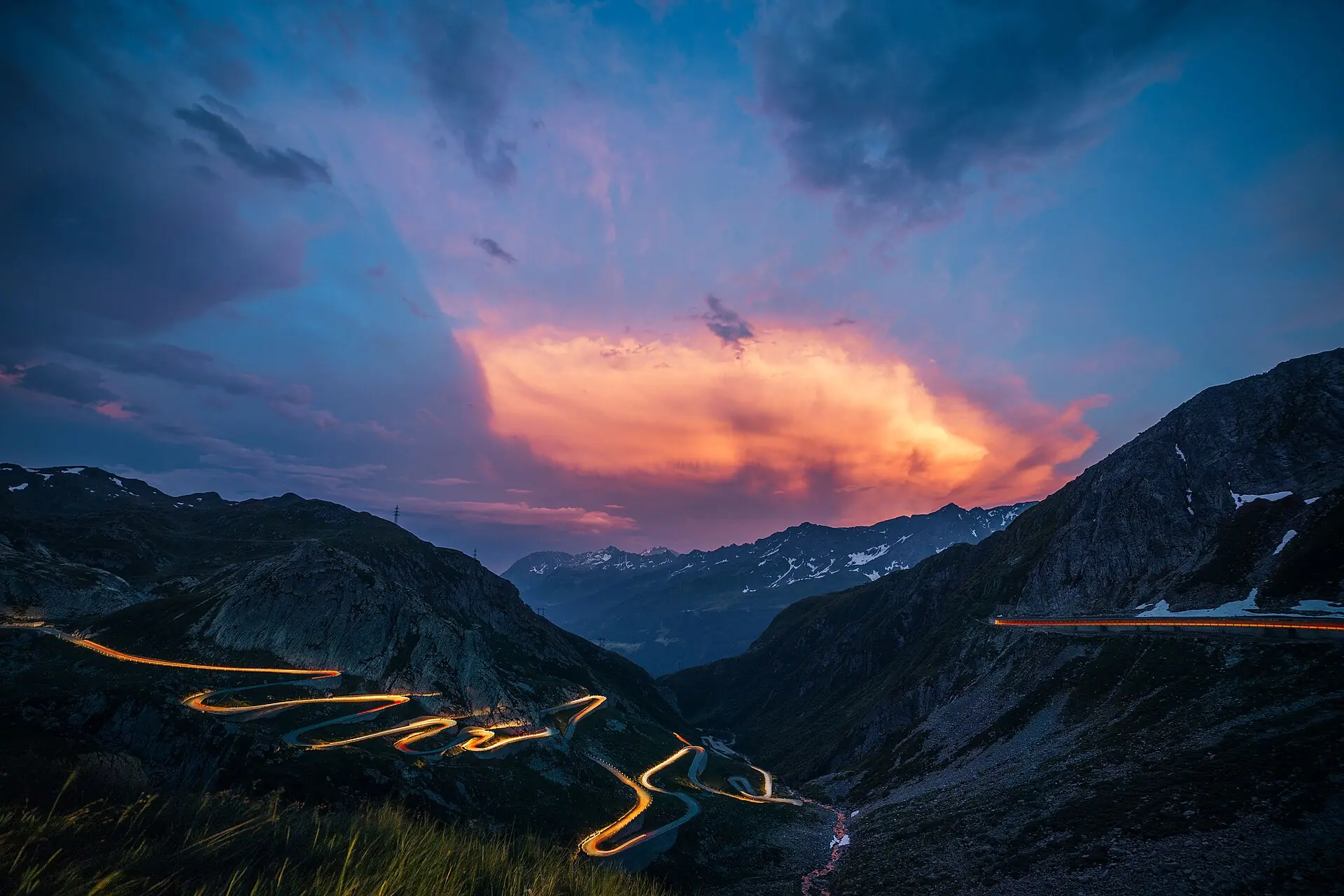 Headlight trails on the Tremola switchbacks, Gotthard Pass, at dusk