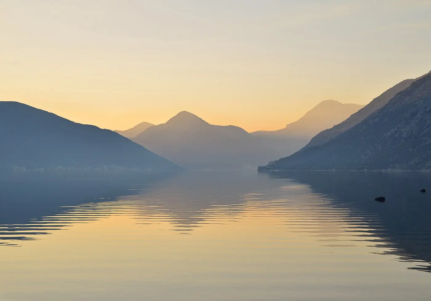 Mountains reflected in the Bay of Kotor at dusk